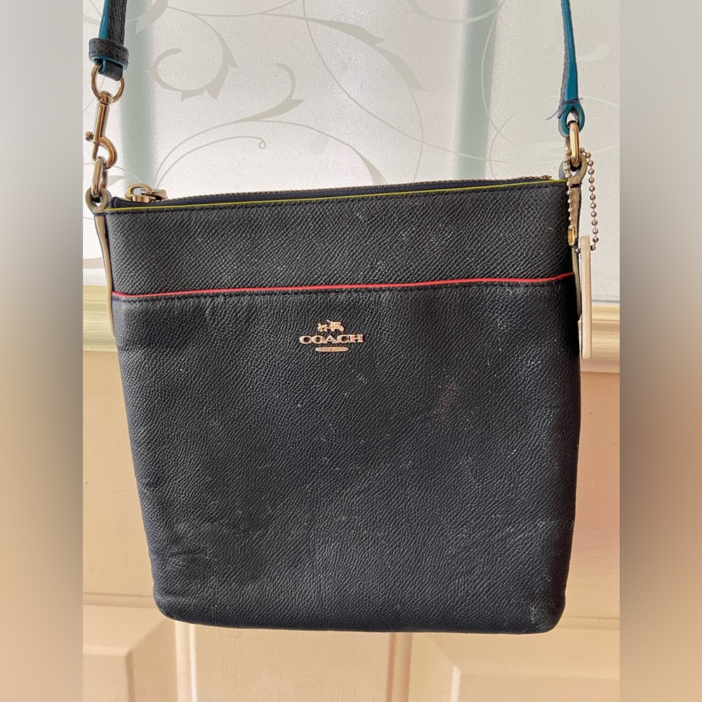 Coach Kitt navy blue double cross grain leather zip top adjustable strap bag.